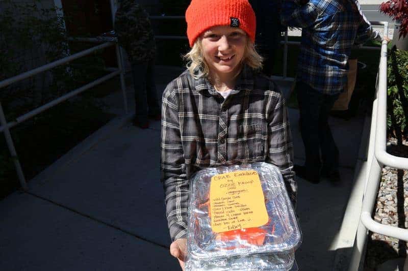 5th grader holding a tray of food