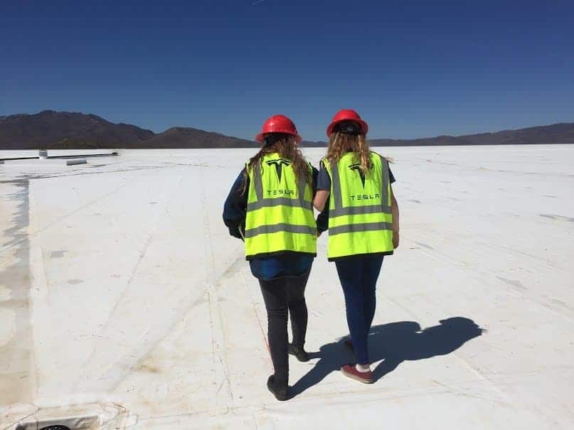 students on top of the tesla building