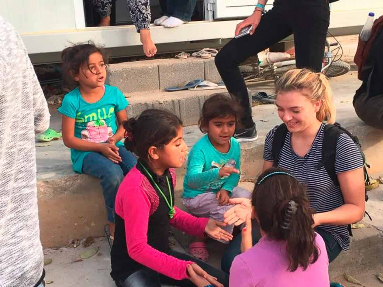 student working with greek refugees