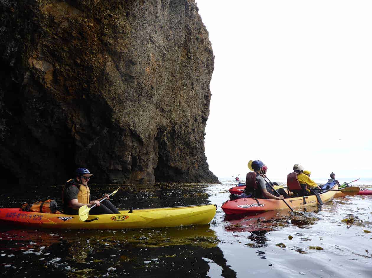 students in kayaks on the water