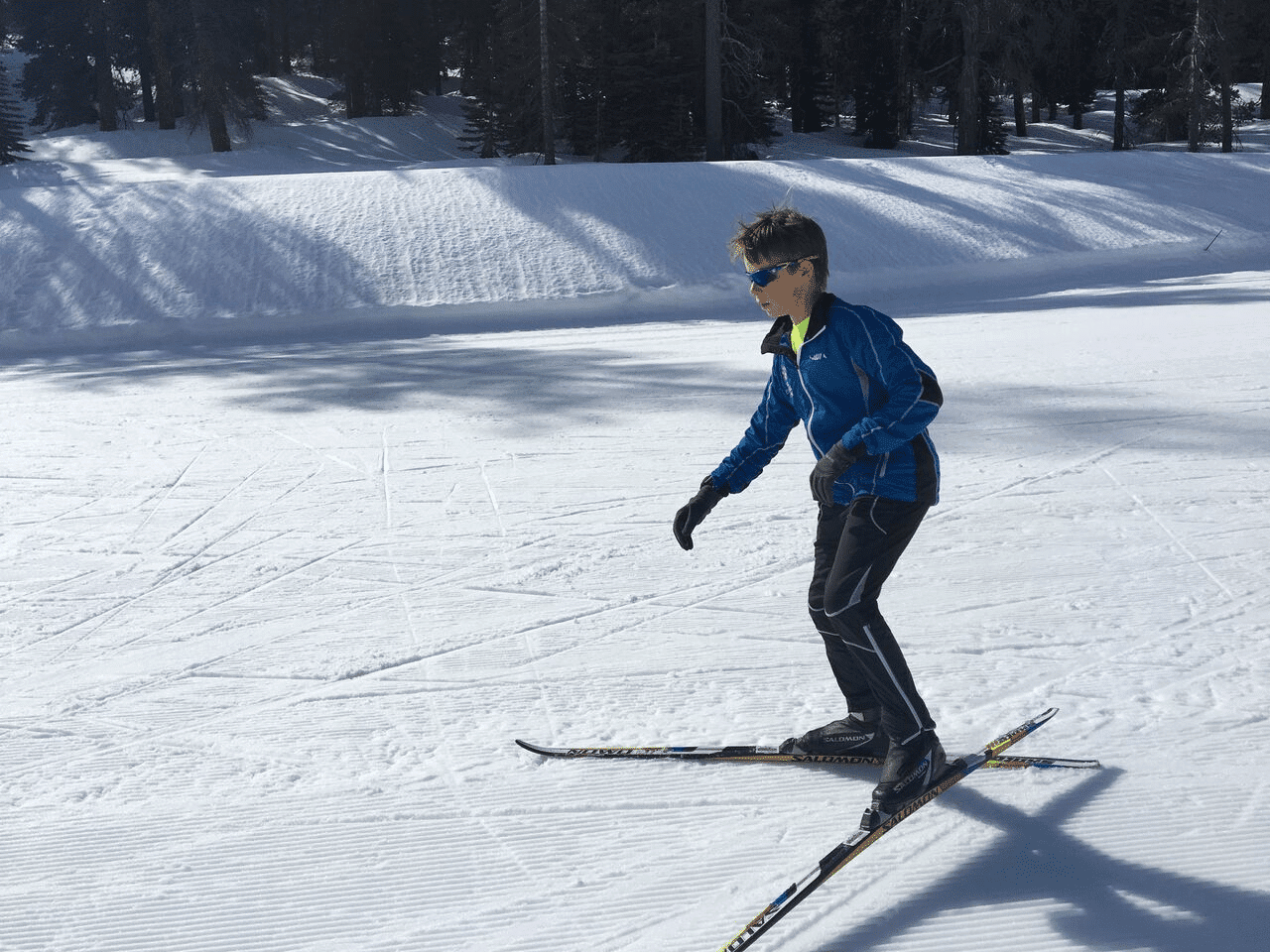 student skiing down a slope