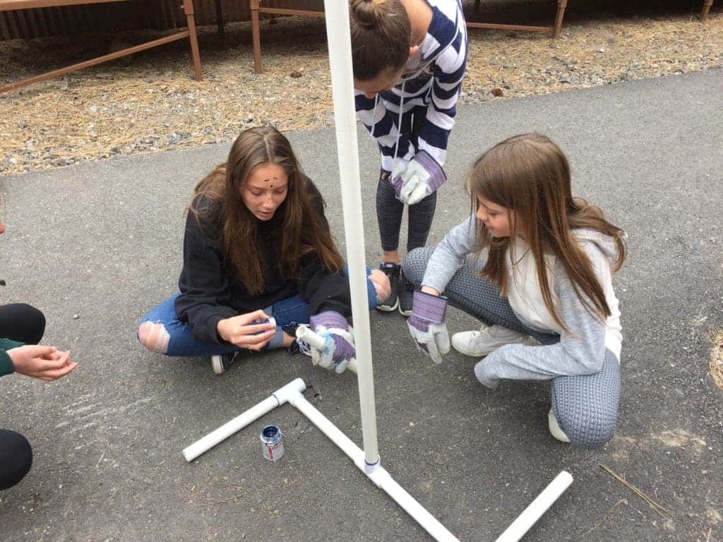 students outside working on the wind turbine