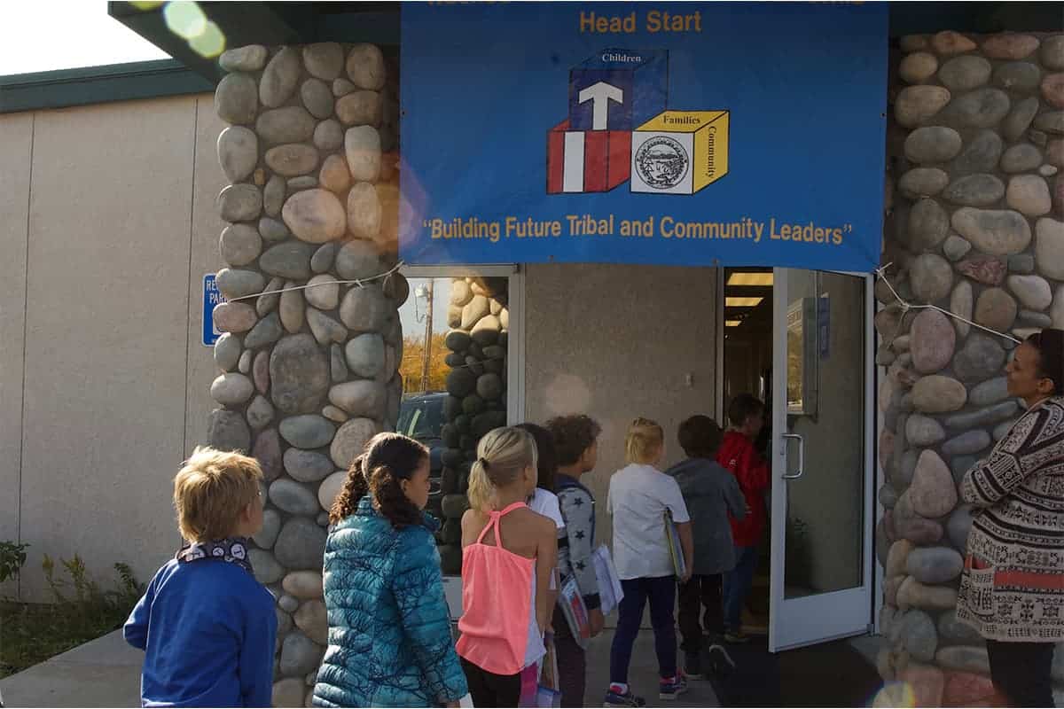 students walking into a building