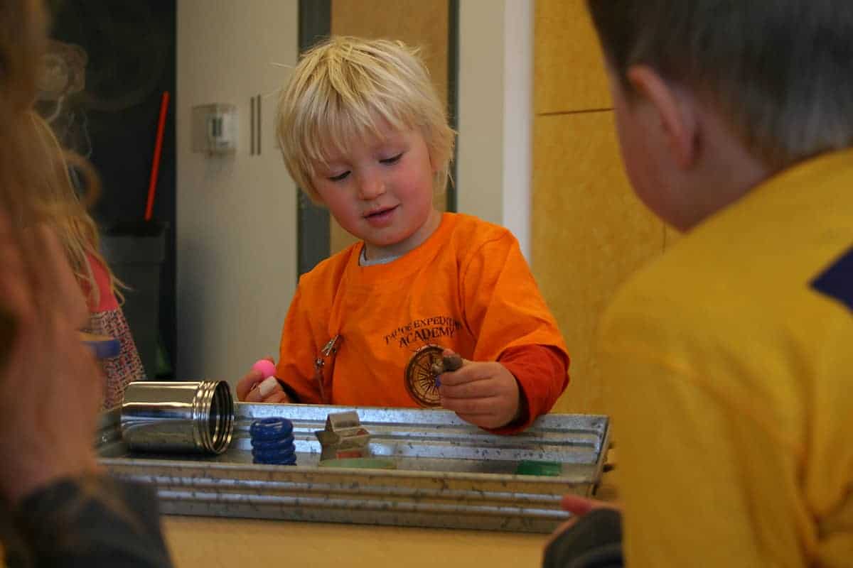 pre-k student holding a mushroom