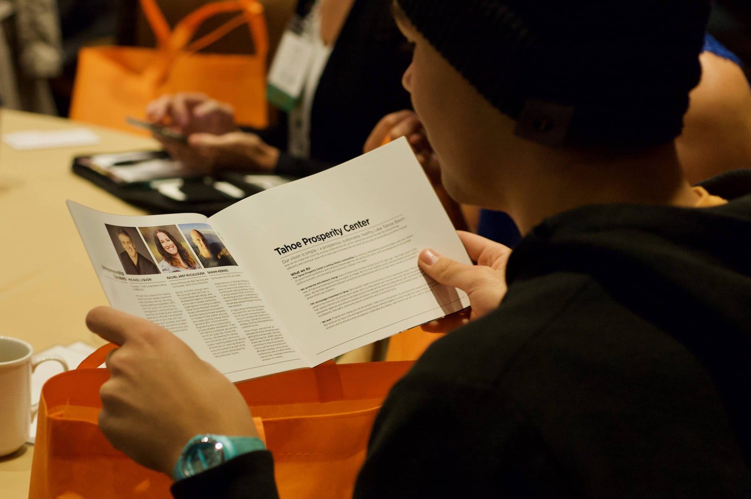 student reading a pamphlet