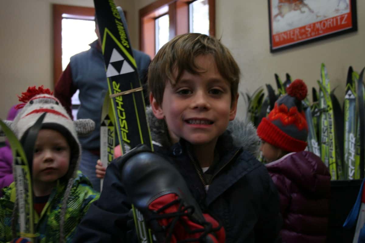 pre-k students holding skis