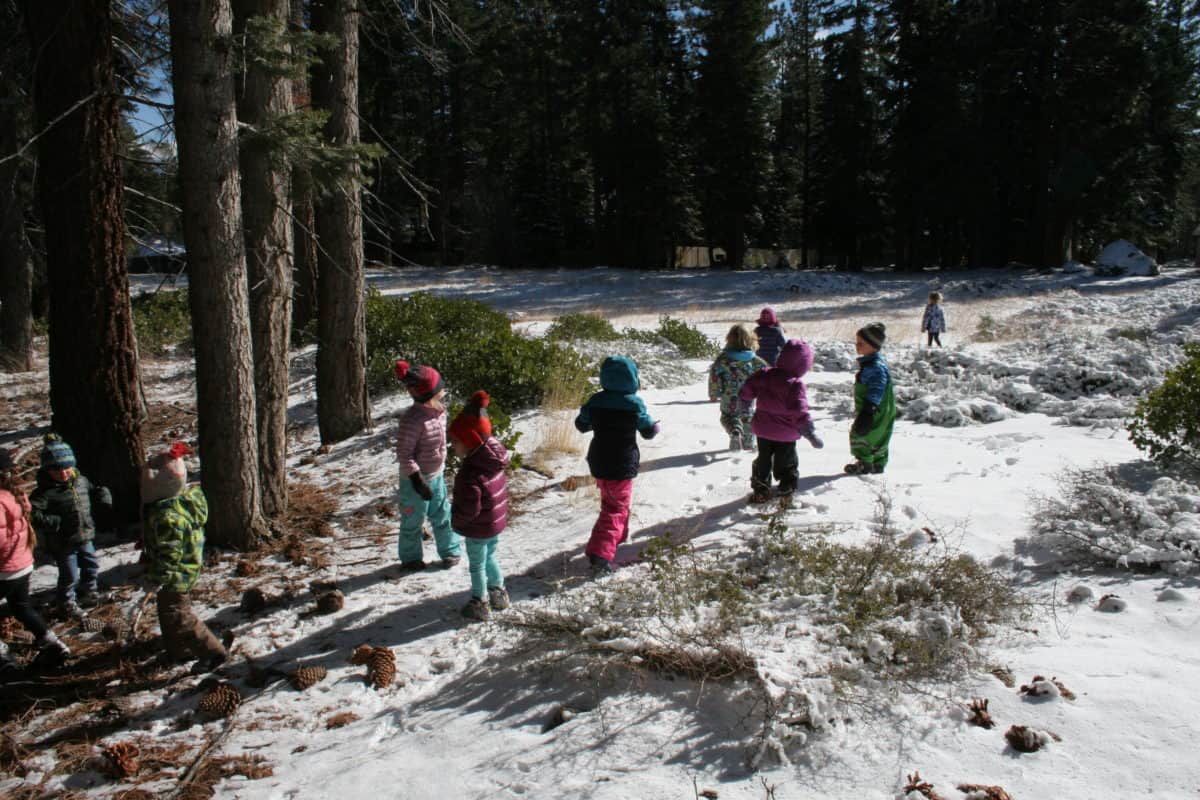 pre-k students trekking through the snow