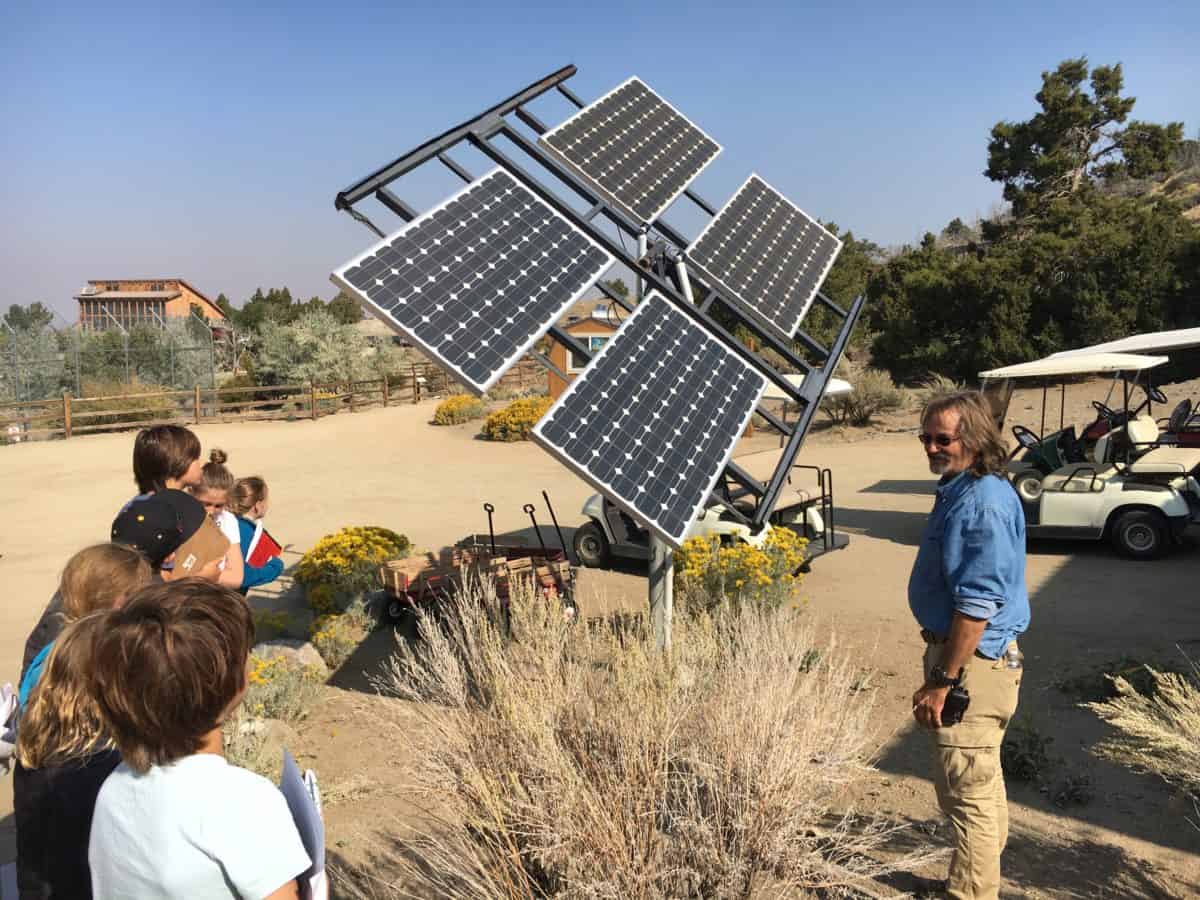 students looking at solar panels