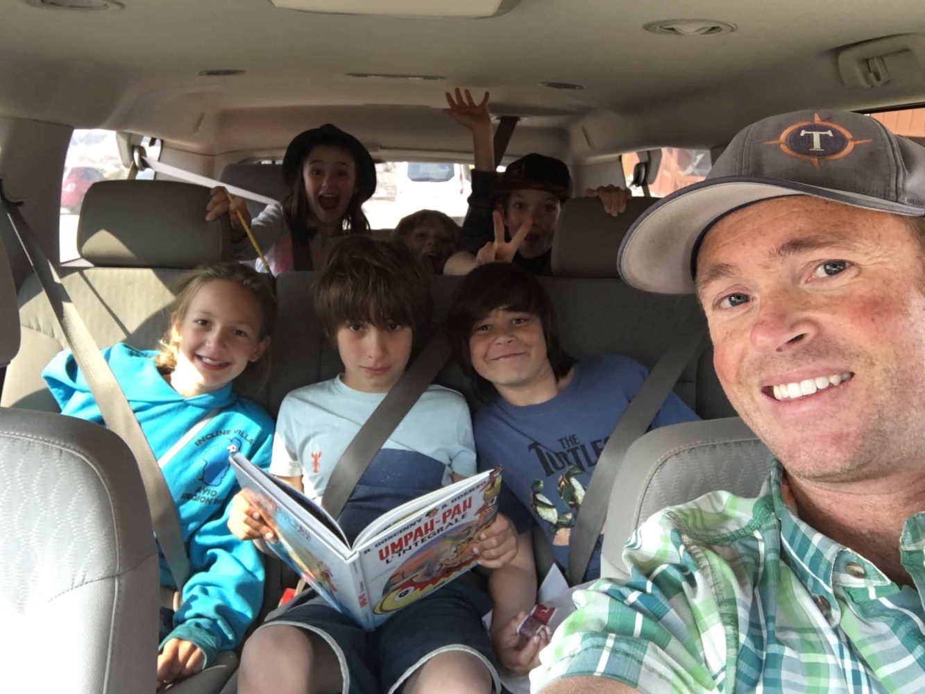 car selfie with teacher and students