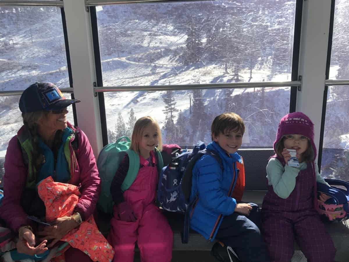 pre-k students and teacher in a ski lift