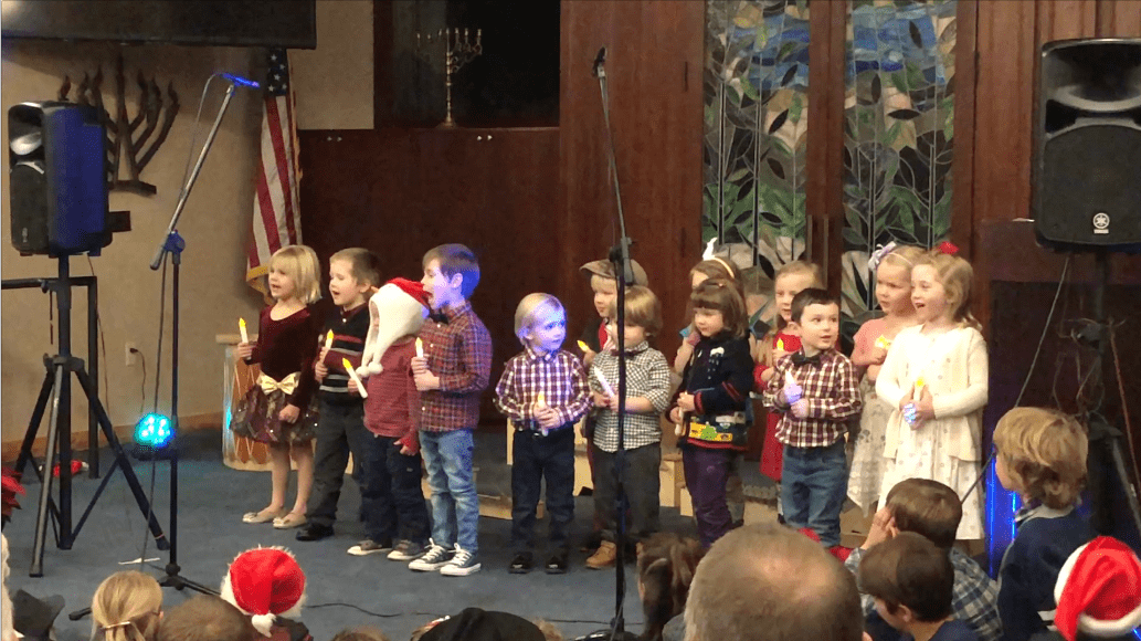 students onstage at the holiday performance