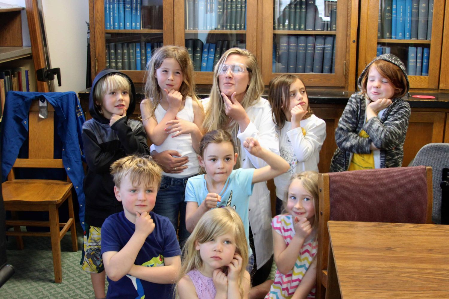 students with their teacher smiling for the camera