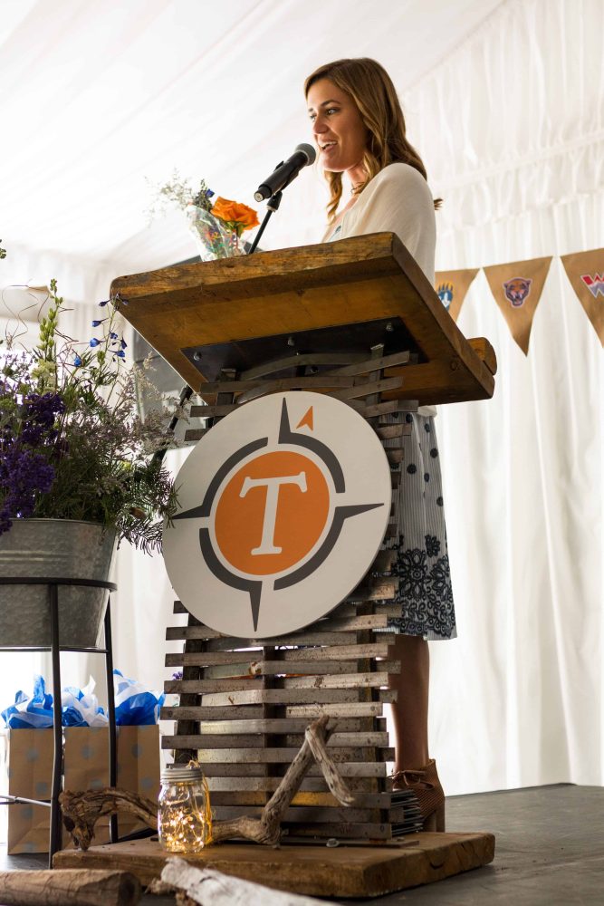 a teacher speaking from a podium