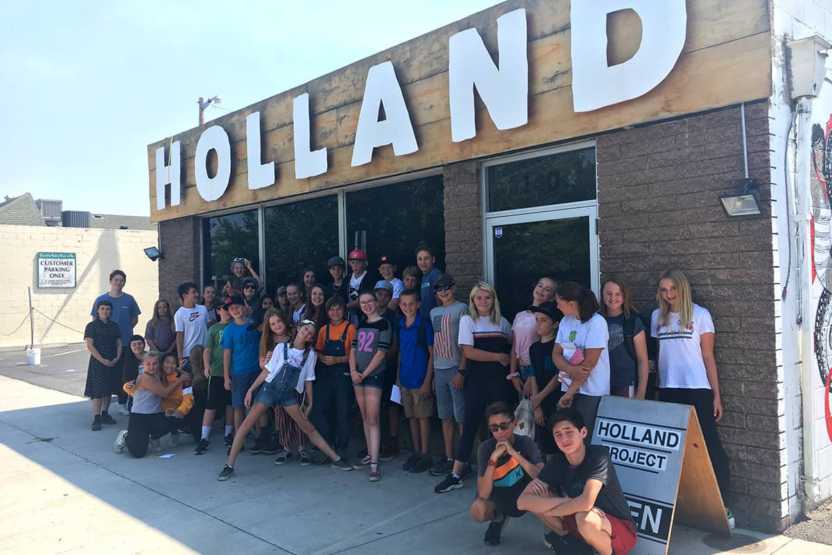 students in front of holland project building