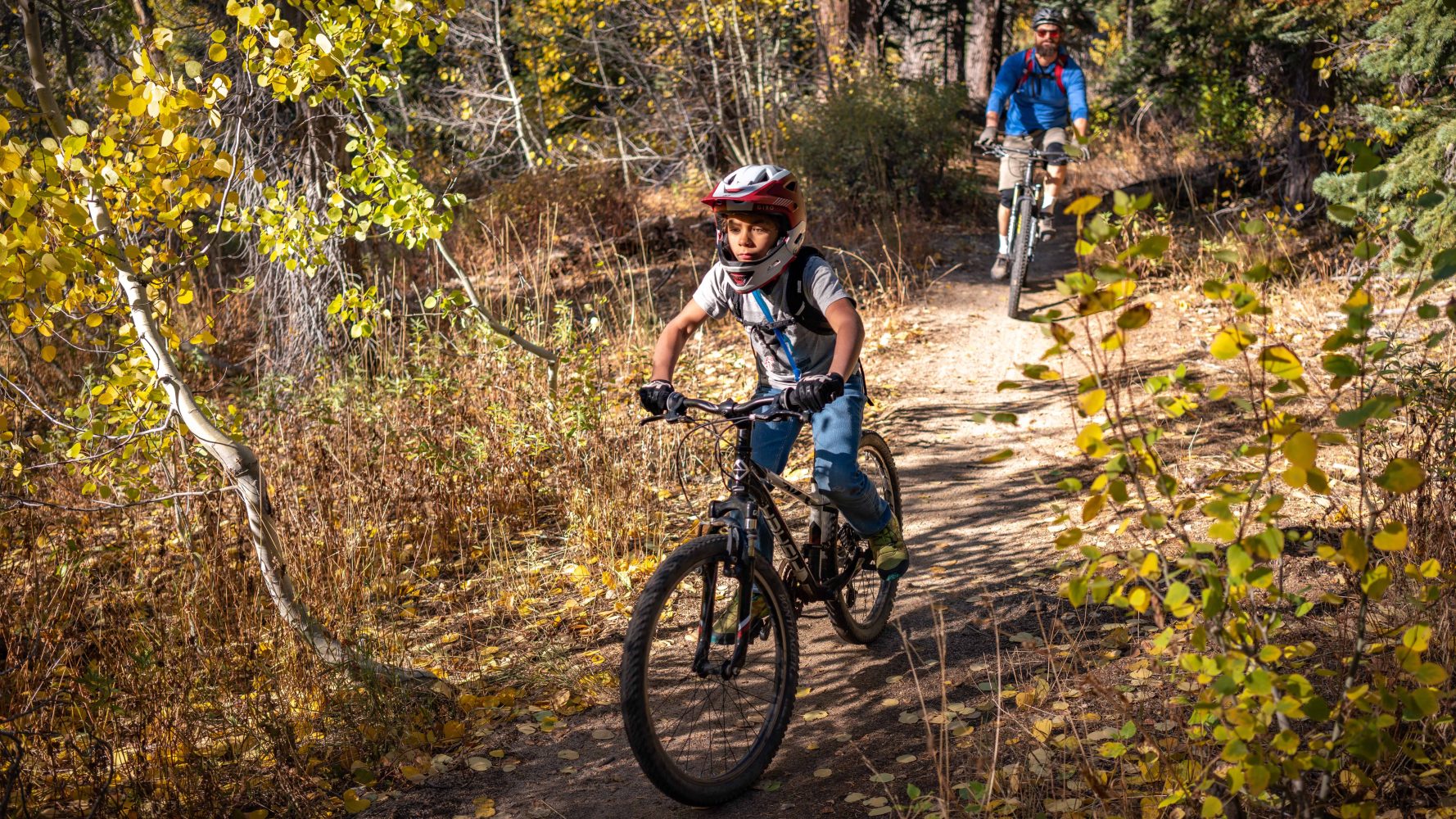 teacher following student on a trail