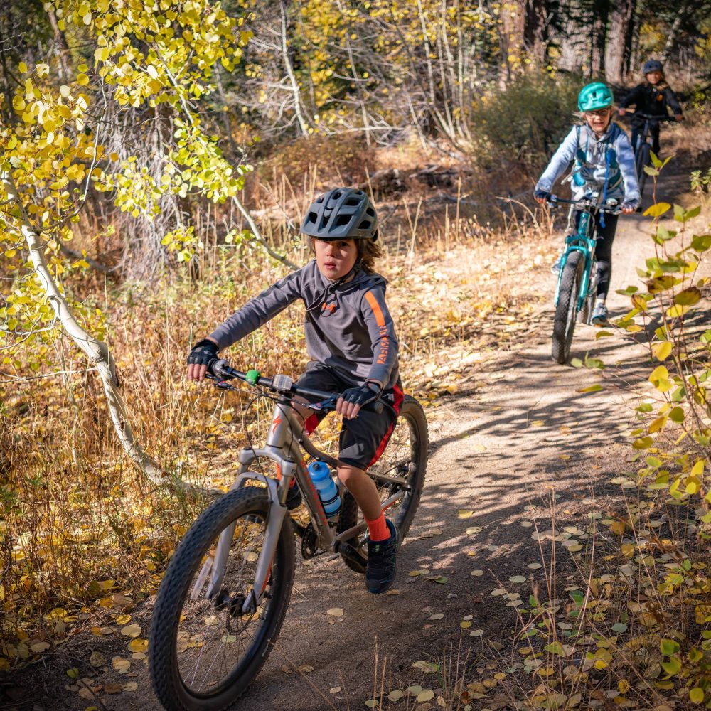 students riding down a tahoe trail
