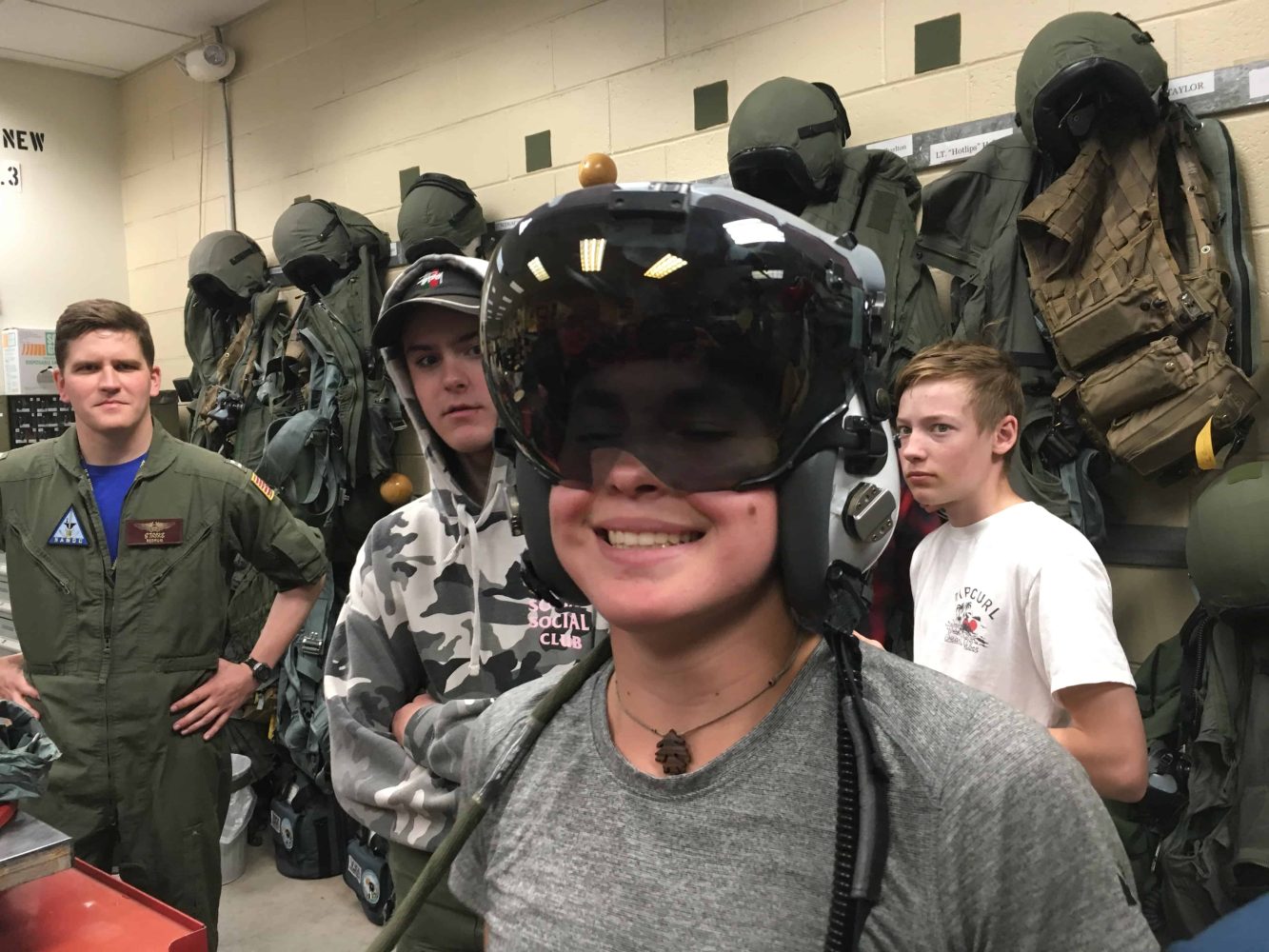 students putting on g suits and hud helmets