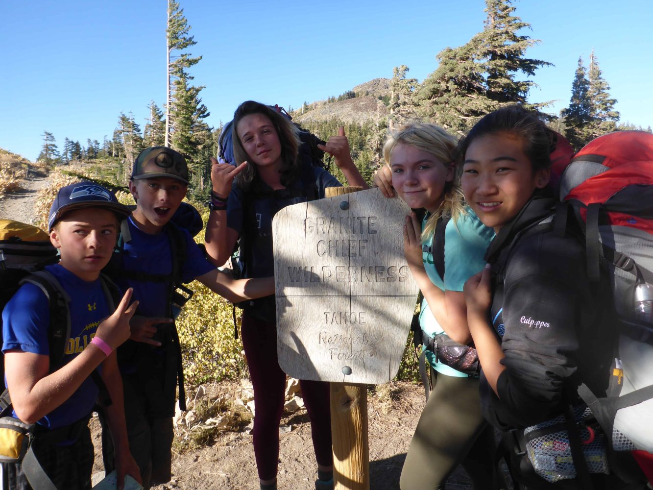 students next to granite chief wilderness sign
