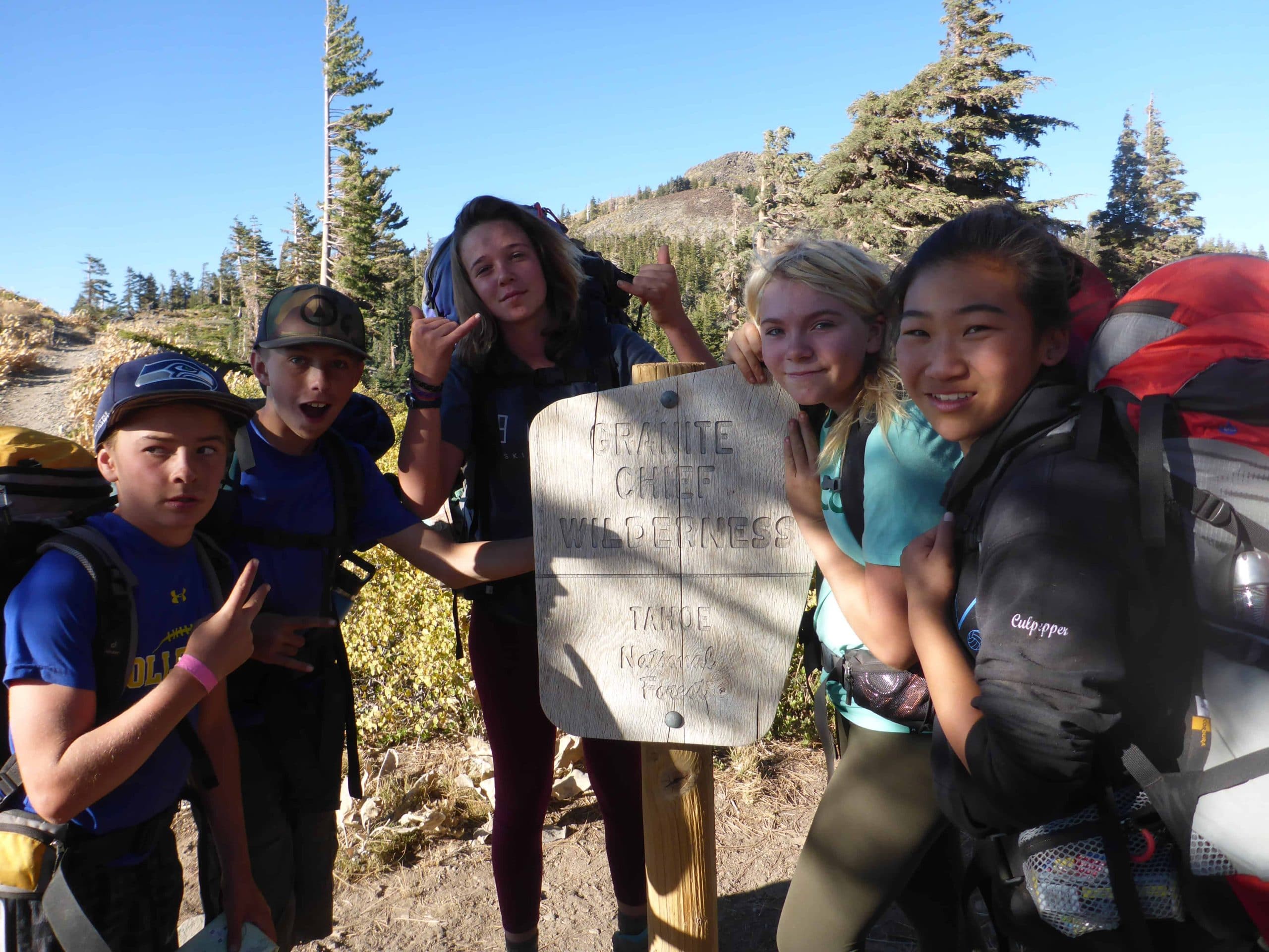 students next to granite chief wilderness sign