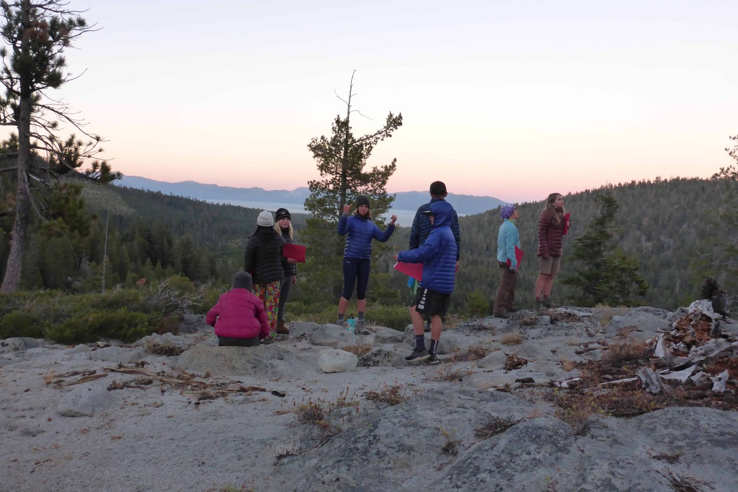 students standing next to the trail