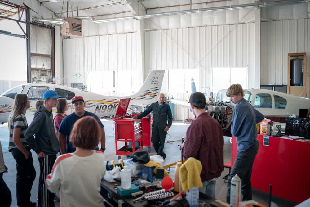 students learning about combustion engines in planes