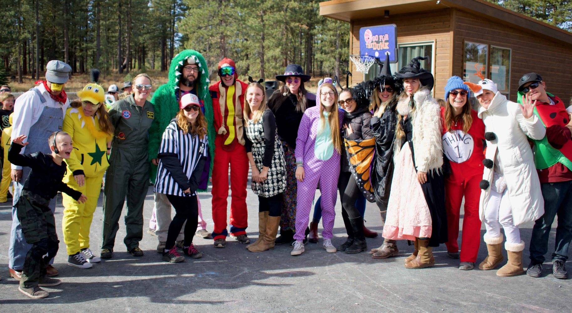 students in costume smile for the camera