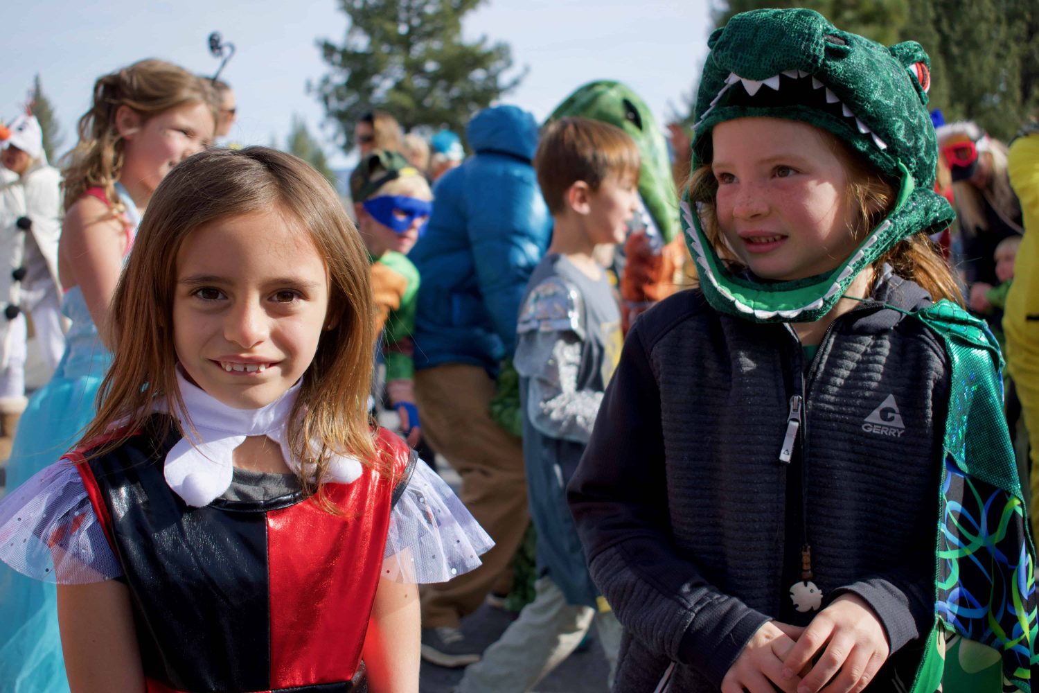students in costume smile for the camera