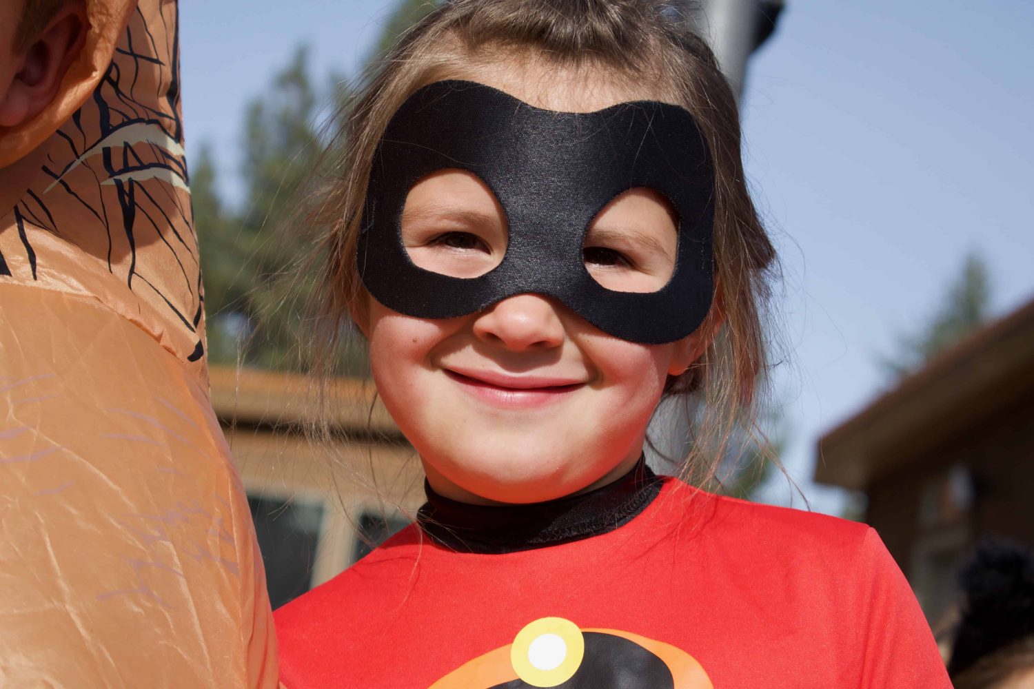 student in costume smiles for the camera