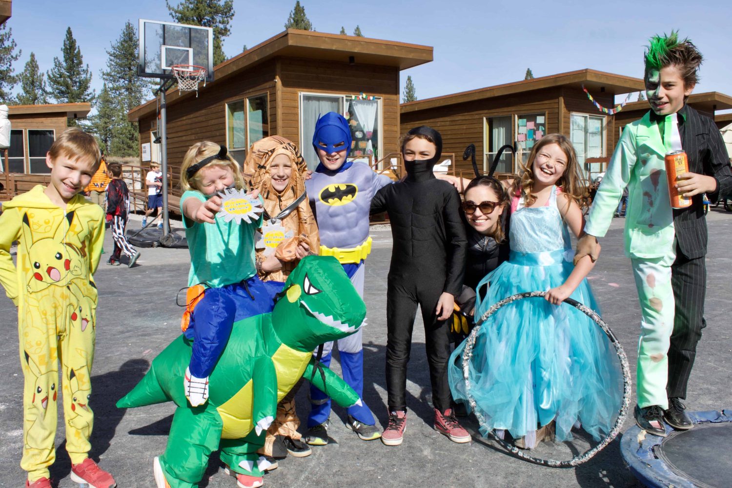 students in costume smile for the camera