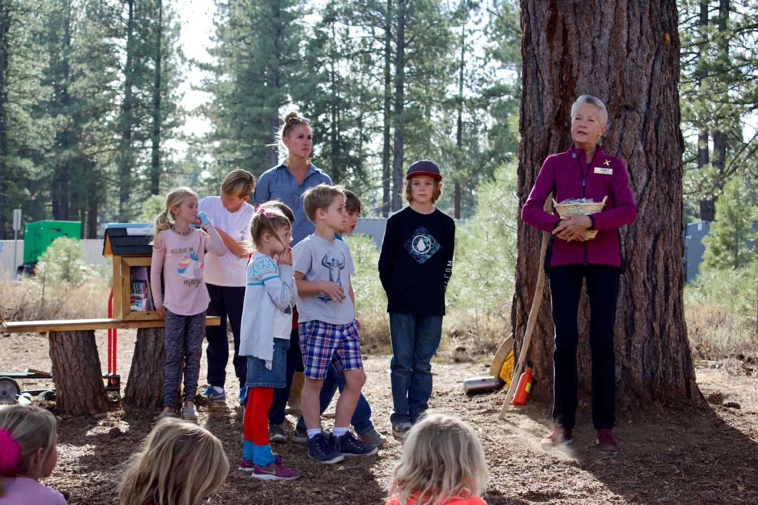 mayor carolyn wallace speaking to students in the woods