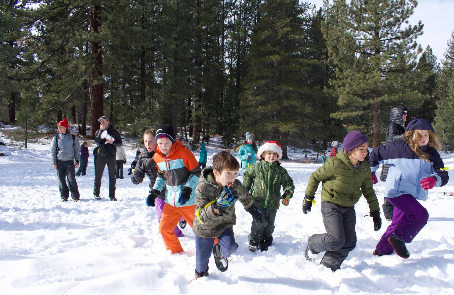 students running through the snow