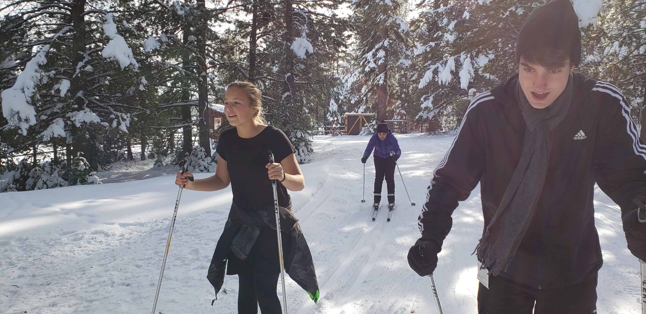 students skiing down a slope