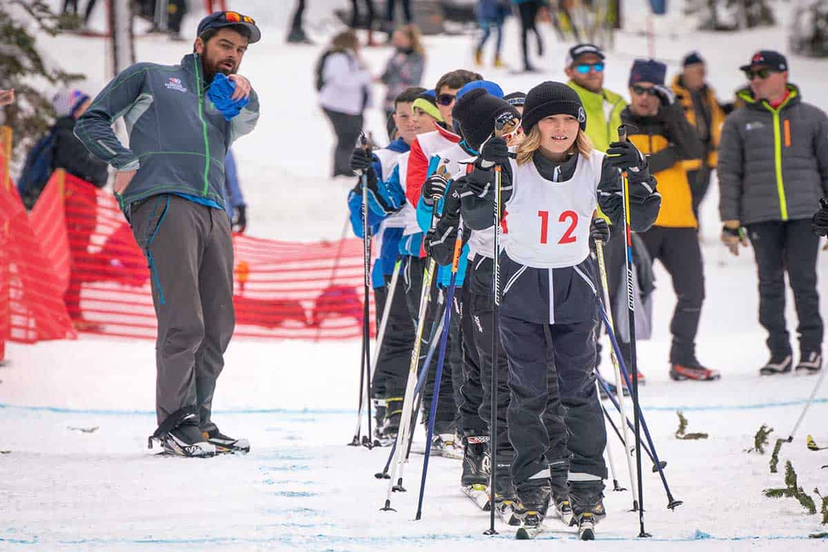 students skiing down a slope