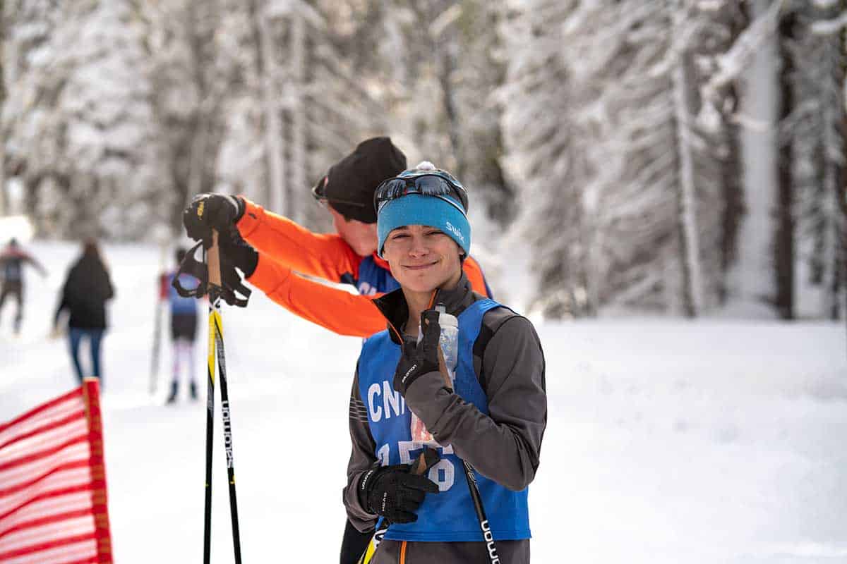 a biathlete student smiling for the camera