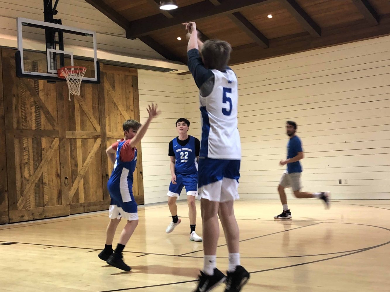 basketball player shooting for the hoop