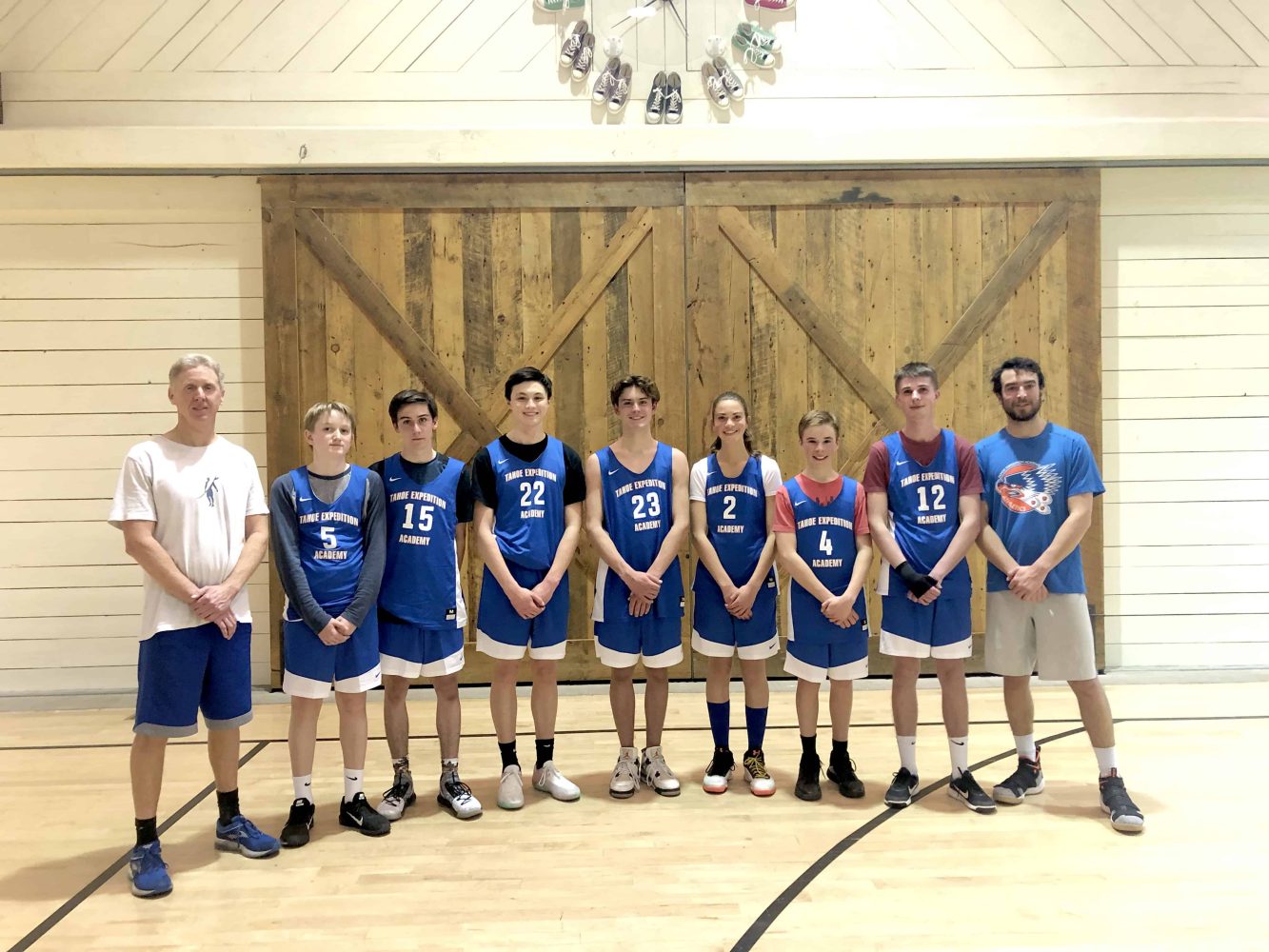 the basketball team getting their picture taken