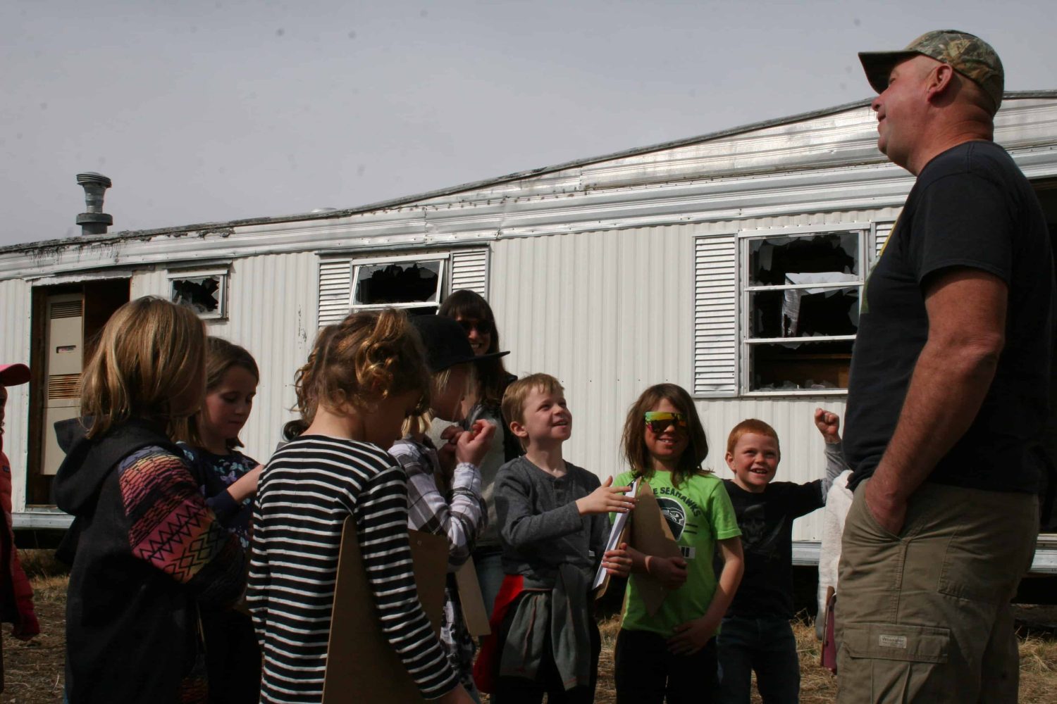 students gathered around their teacher