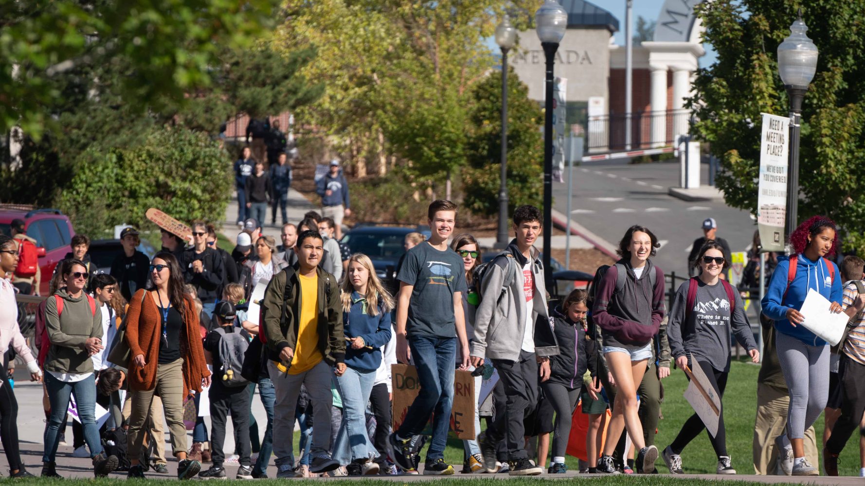 climate change protesters marching through a field