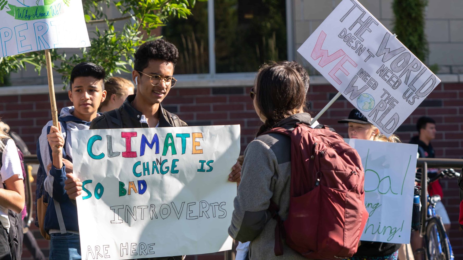 students showing each other their protest signs