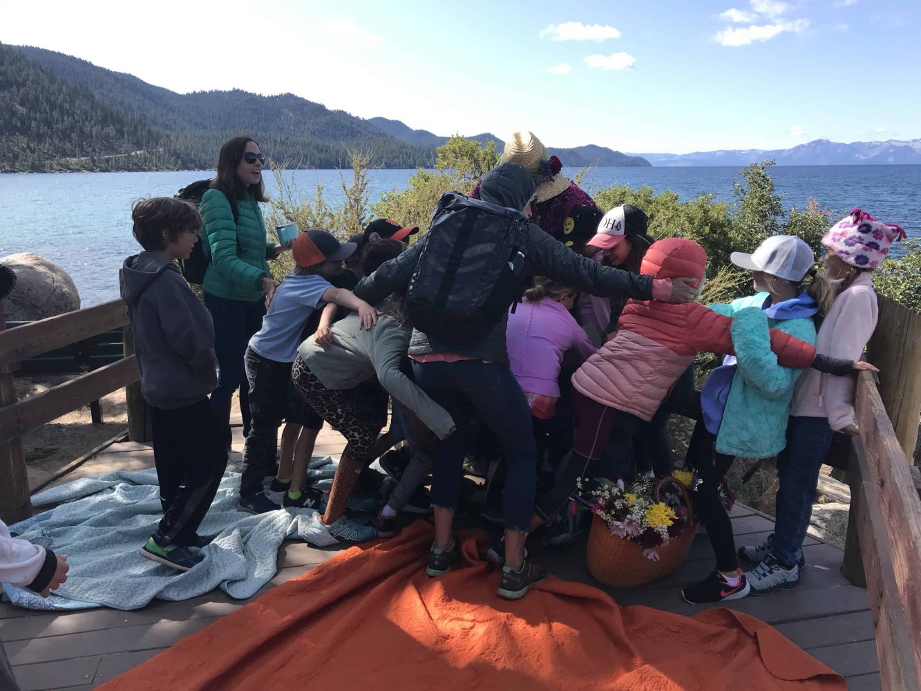 students looking out at the lake over a balcony
