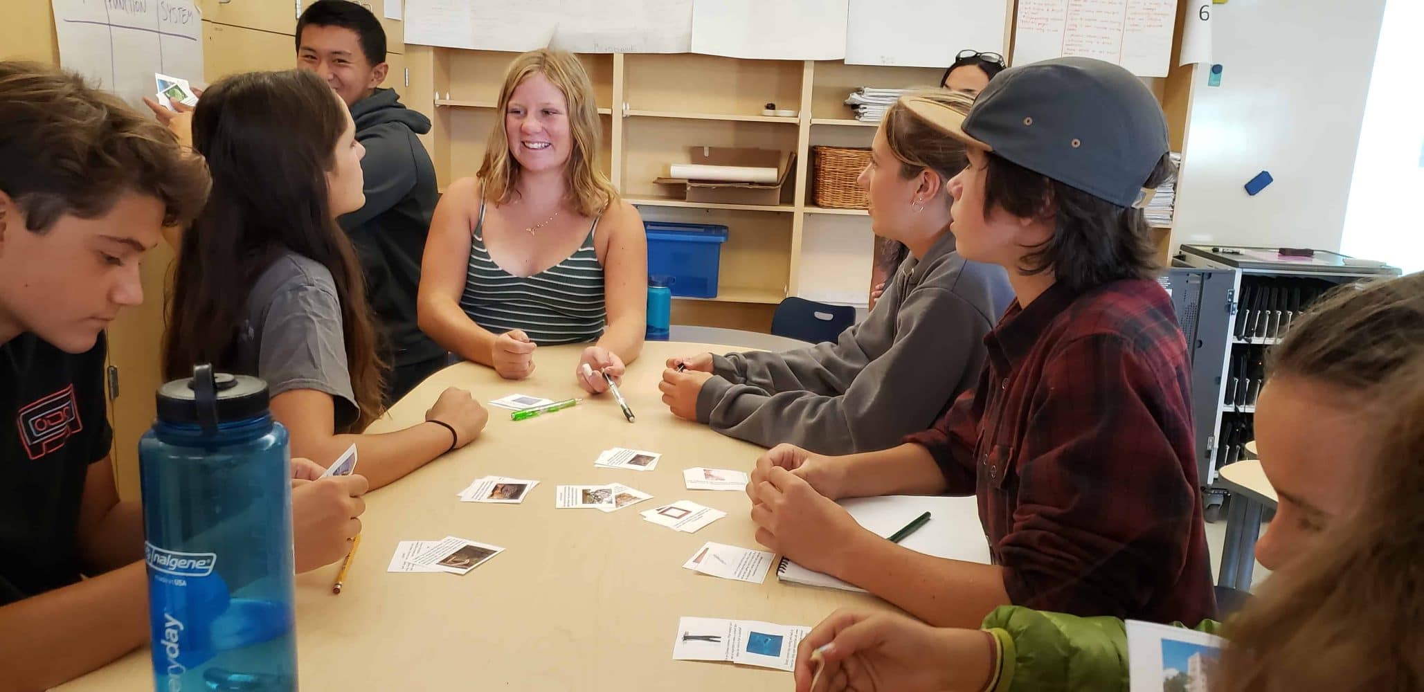 students sitting around a desk