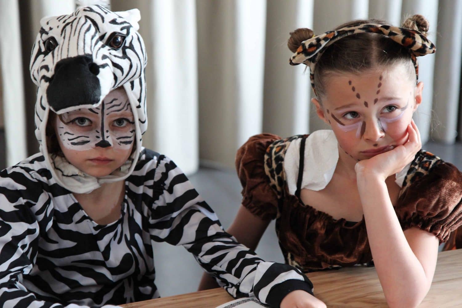 club member in costume sitting at a table