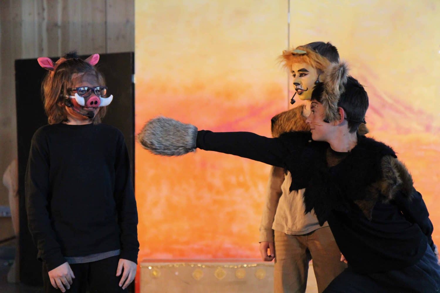 the drama club performing the lion king onstage
