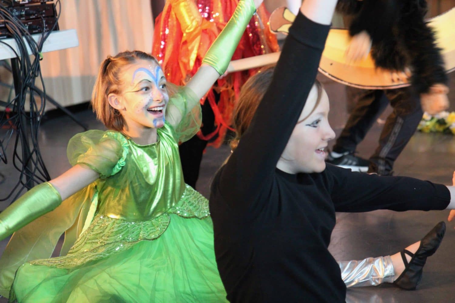 the drama club performing the lion king onstage