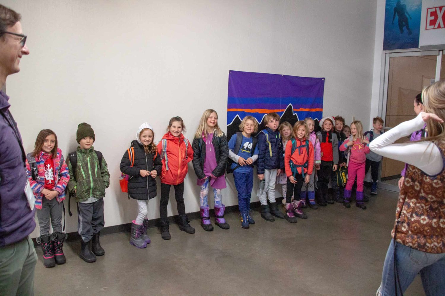 the class lined up against a wall