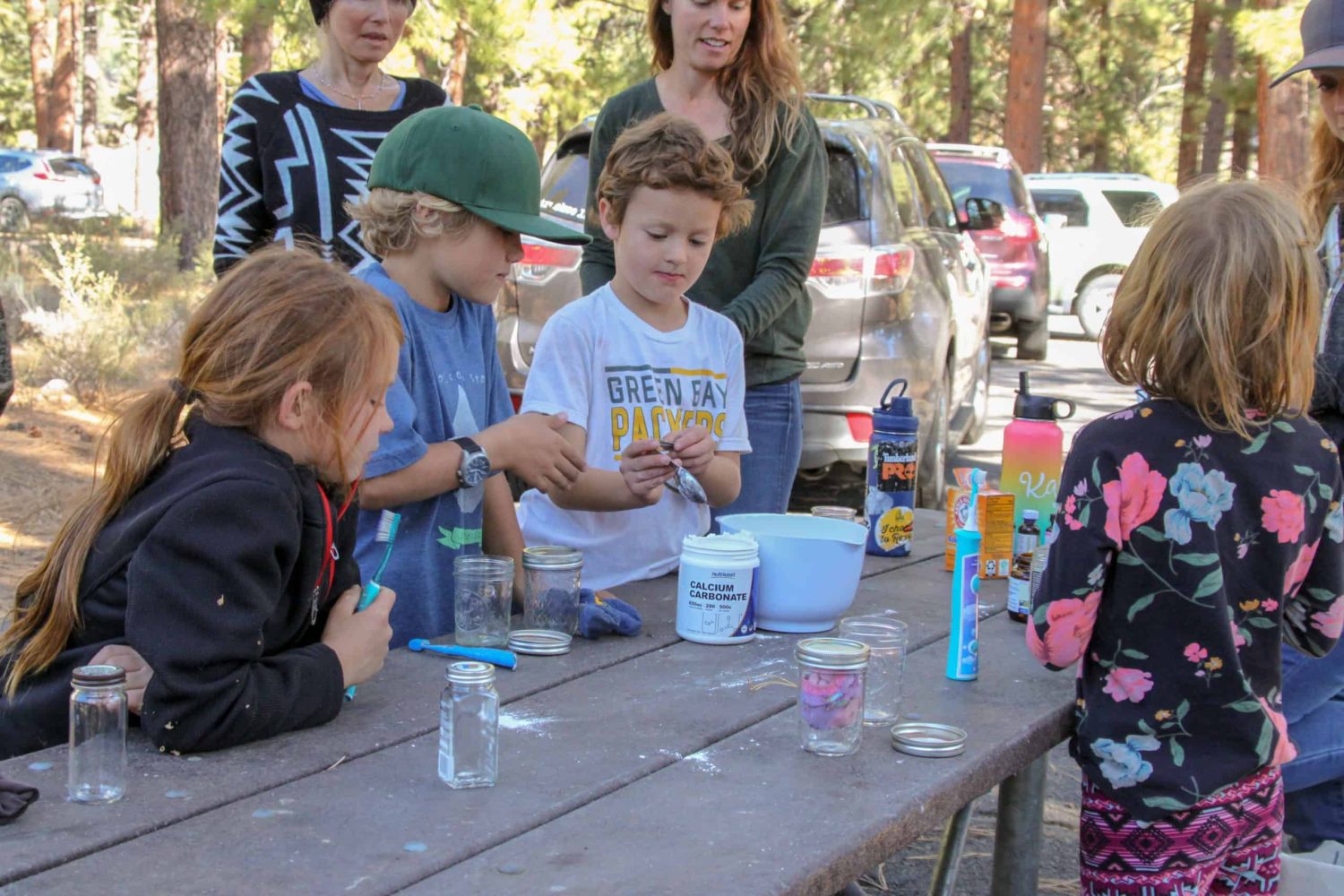 kids working at a table outside