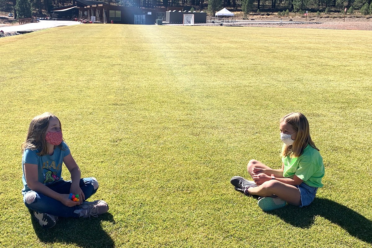4th graders sitting in a field