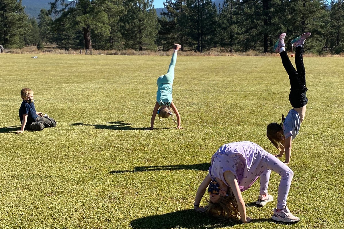 kindergarteners stretching and playing
